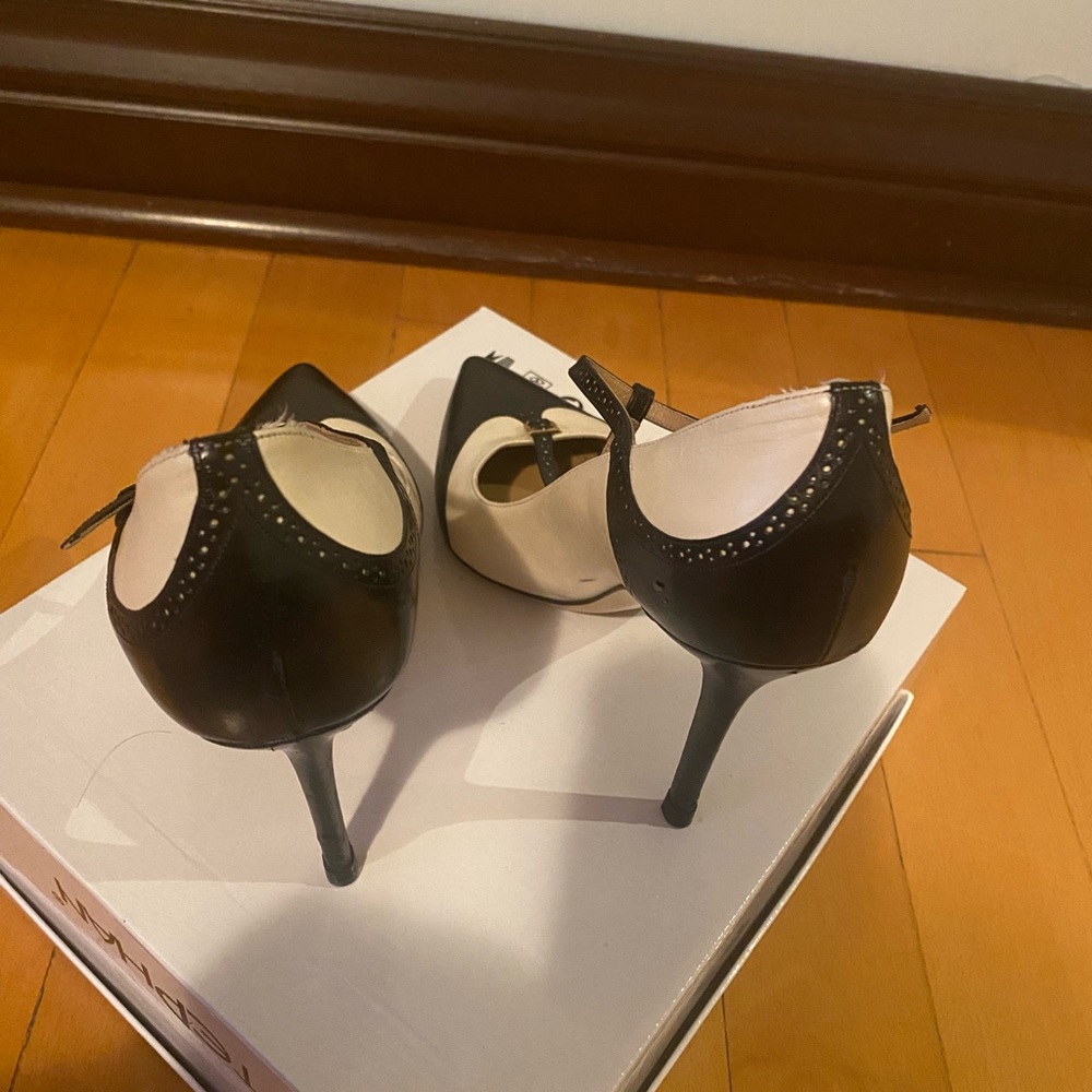 Elegant Ferragamo high heels pump dark blue and white . Very exclusive pair .